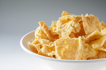 Closeup of a bowl of golden tempting fried yuba