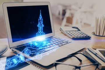 Desktop computer background in office and start up theme hologram drawing. Double exposure. Startup...