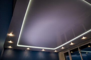 Beautiful stretch ceiling with led lighting, spotlights around the perimeter.