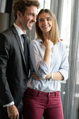 Young love couple smiling in the comfortable apartment