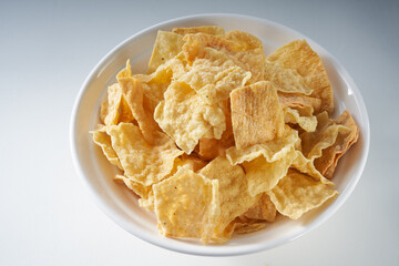 Closeup of a bowl of golden tempting fried yuba