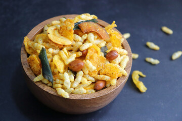 Murmura cornflakes Chivda or Chiwada. Diwali special savory snack mixture, made out of puffed rice, fried peanuts, curry leaves, and some spices. Traditional Indian Diwali Snacks. with Copy Space.
