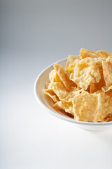 Closeup of a bowl of golden tempting fried yuba