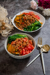 Delicious tomato spaghetti on the table (Served with cauliflower, pumpkin, Garland chrysanthemum)  top view