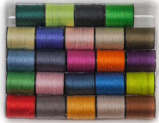A set of colored threads on the coils