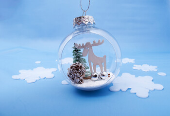 Christmas ornament on abstract blues background. Winter set