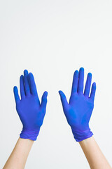 Blue Latex doctor Hand Gloves,Hand women five finger symbol with glove of doctor on blue background