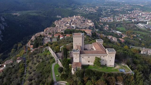 Aerial view of Narni in Umbria in central Italy with castle rocca Albornoziana in the foreground and the city in the background. backward move.