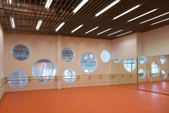 Modern university buildings, architecture and interior, studio with dance barre. 