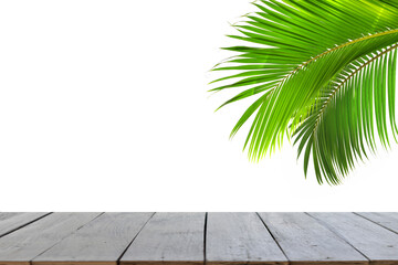 Old wooden boards and beautiful green coconut leaves perfect for presentations (focus selection).