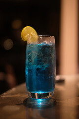 Blue drink with a dark backdrop