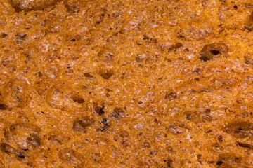 Texture of wheat-rye brown bread, close-up