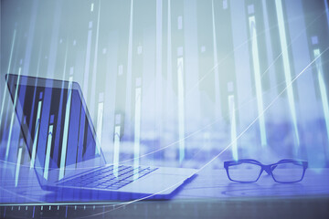 Forex Chart hologram on table with computer background. Multi exposure. Concept of financial...