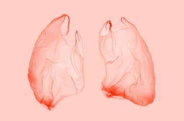 Pink plastic bag in pink light in form of lungs. World pneumonia day. Pneumonia. Covid.