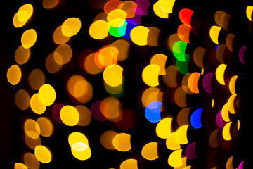  abstract christmas bokeh background with colorful lights on dark background