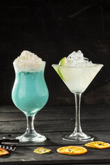 Alcoholic Cocktails blue pina colada highball and margarita on black background