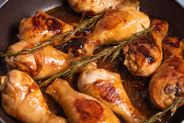 Cooking Algerian chicken in a spicy sauce with vegetables in a pan