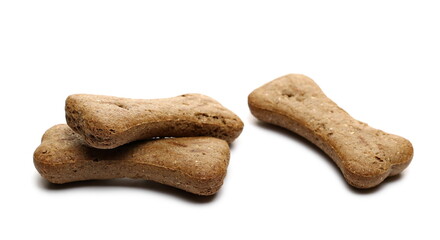 Dog food, brown pet treats in bone shape isolated on white background