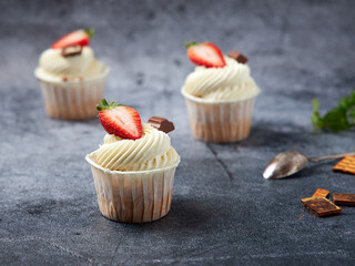 Closeup of fruit cupcakes with butter cream