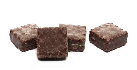 Chocolate wafer blocks, cubes pile isolated on white background