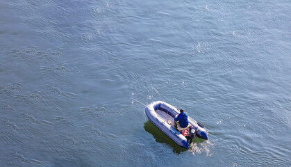 Obraz premium Fishing from an inflatable rubber boat