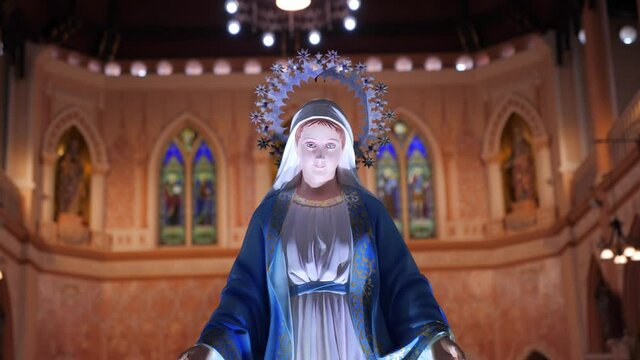 The Blessed Virgin Mary in front of the Roman Catholic Diocese, public place.
