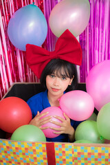 Fototapeta na wymiar an asian girl in baloon party