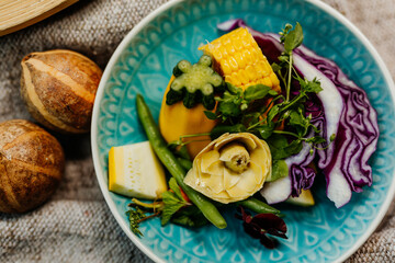 Healthy vegetarian food for a balanced diet rich in vitamins. Organic and regional products. Corn, artichokes and red cabbage