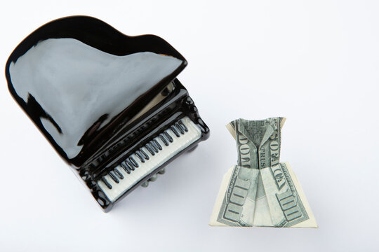 image of piano money white background