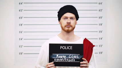 Mugshot of criminal thief in ha at police department