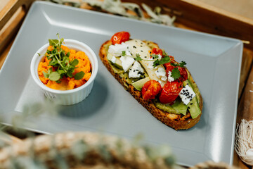 Healthy vegetarian food for a balanced diet rich in vitamins. Organic and regional products. Bread, tomatoes, avocado