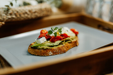 Healthy vegetarian food for a balanced diet rich in vitamins. Organic and regional products. Bread, tomatoes, avocado