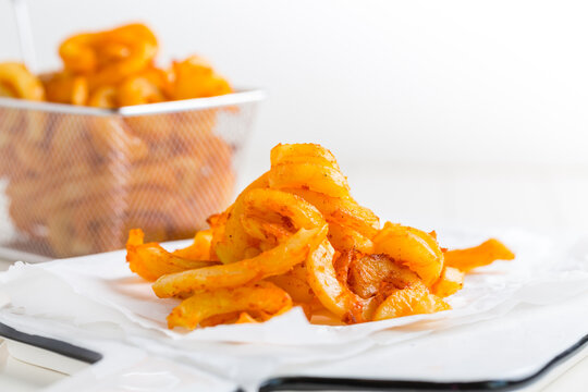 Spicy seasoned curly fries. Ready to eat.