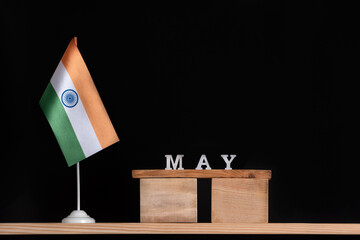 Wooden calendar of May with Indian flag on black background. Holidays of India in May .