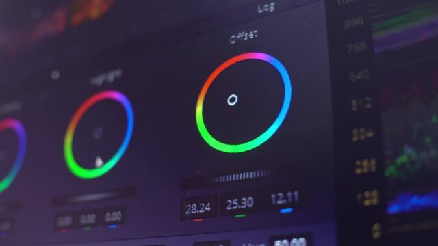 Color correction, color circles in the editing program on the computer display. A professional performs color correction of the video .