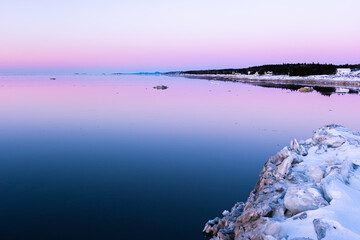 Winter ice at the sunset on the Saint-Lawrence river, Quebec, Canada.