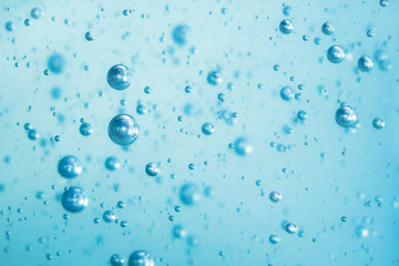 Light blue Air bubbles in alcohol gel. anti virus COVID-19 backdrop. Abstract background about cleanliness, shampoo bubbles, macro bubbles