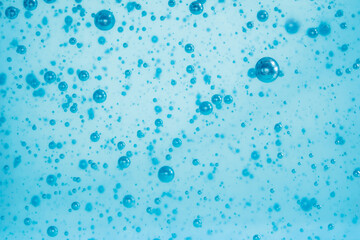 Light blue Air bubbles in alcohol gel. anti virus COVID-19 backdrop. Abstract background about...