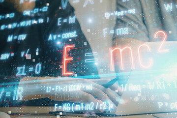 Science formula hologram with man working on computer on background. Education concept. Double exposure.