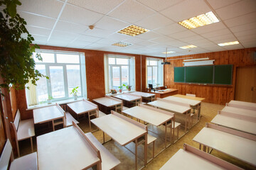 Interior of an empty school classroom. Concept of coronavirus COVID-19 quarantine in schools and educational institutions