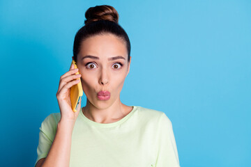 Close-up portrait of her she nice attractive lovely charming gorgeous stunned girl talking on phone pout lips incredible news isolated bright vivid shine vibrant blue color background