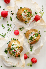 Baked stuffed potatoes with a vegetarian filling consisting of feta cheese, yogurt and vegetables top view
