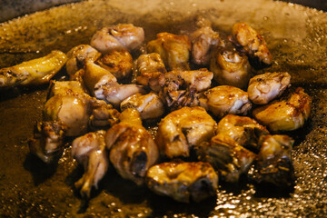 meat for paella cooking in the pan or paella pan. Typical food of Valencia, Spain.