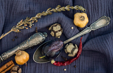 Still life with dried fruits, vegetables and herbs on dark grey textured background. Top view photo of different objects. Colors of autumn.