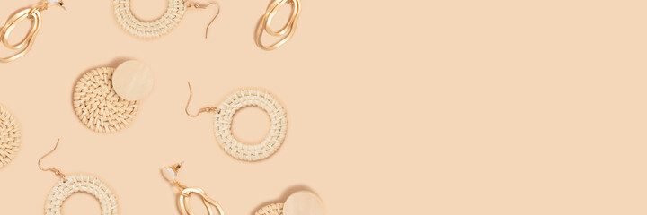Earrings pattern frame on a beige background. Vintage accessories banner with place for your design.