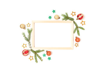 Wooden frame with Christmas decorations on a white background. Creative festive concept with place for your design.