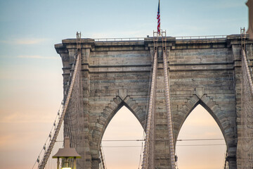 Tall tower of Brooklyn Bridge in New York City