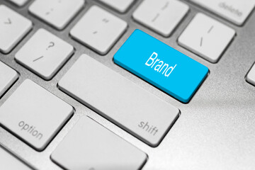 Concept of keyboard with blue button and action.