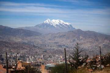 The city of La Paz seen from above with mount illimani in the background - Bolivia