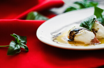 Food in plate on red table background. Laves of mint. Restaraunt, cafe